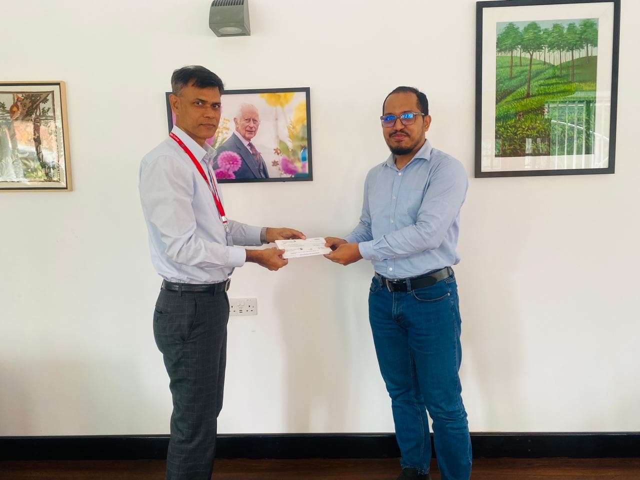 Claim settlement cheque handover to the British High Commission